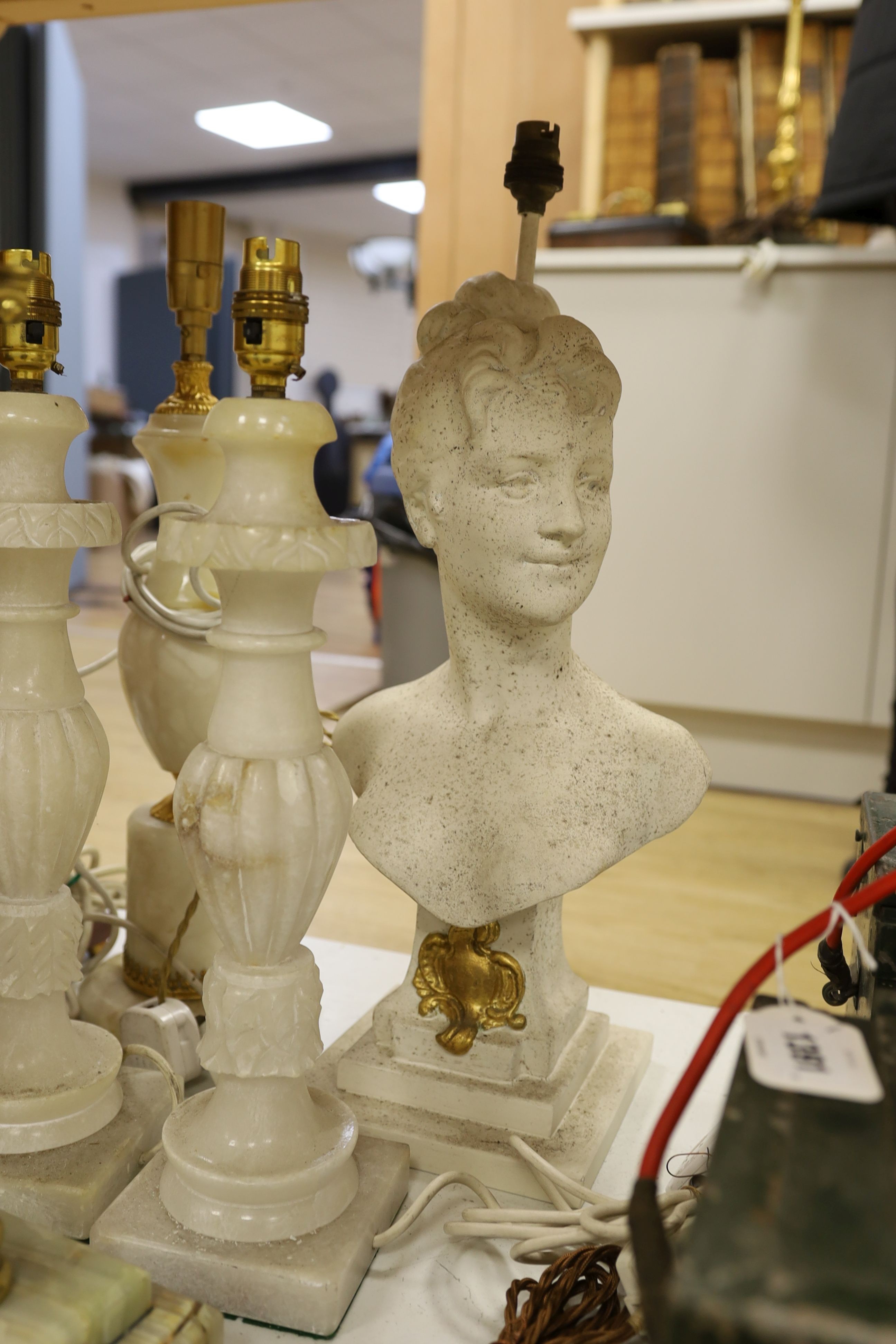 A selection of assorted table lamps including a sphinx-ed base and other decorative bases